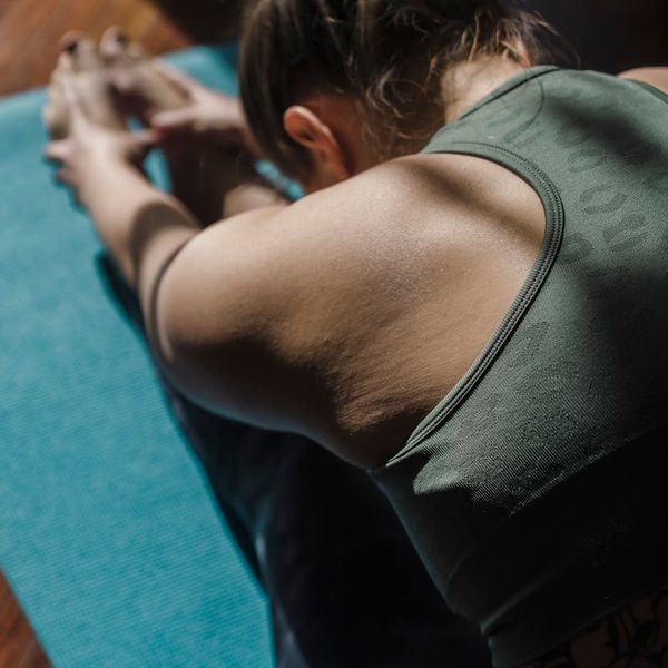 Person balancing on one leg in a calm, focused yoga pose.